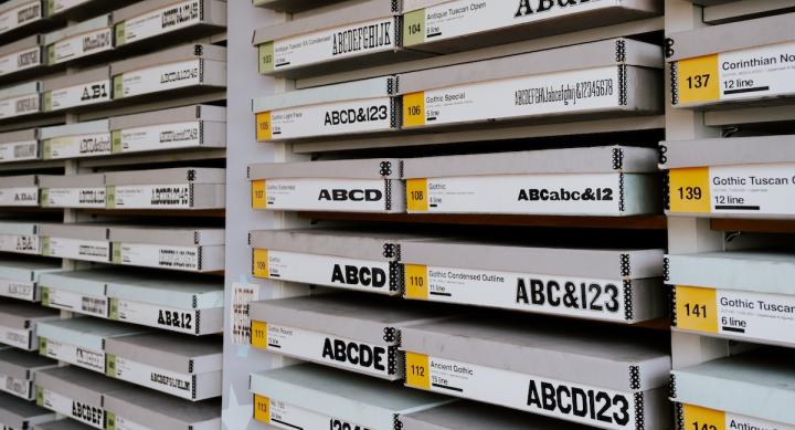 Wall of boxes with wood type from the Rob Roy Kelley American Wood Type Collection.